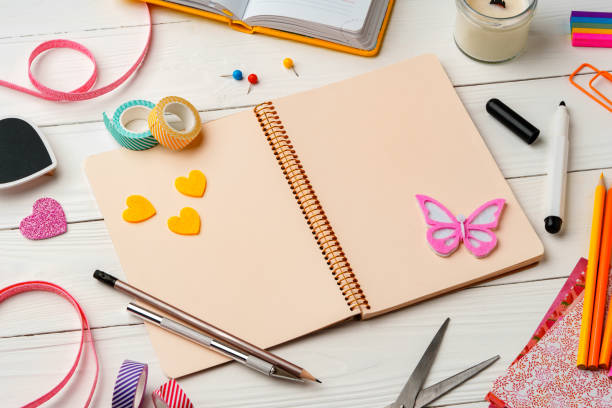 istock Creative workspace with colorful stationery and decorations on a white wooden desk 2194889937