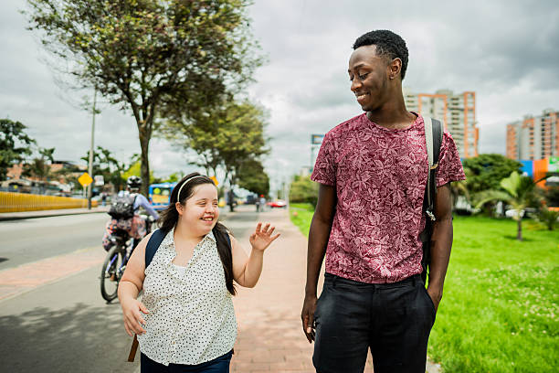 istock Student friends walking and talking in the city 2194891036