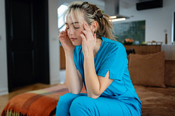 istock An exhausted nurse rests for a moment after a long shift 2194891259