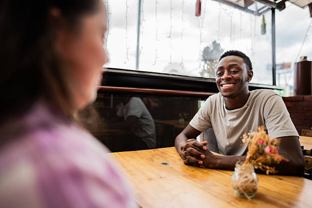 istock Young man talking with friend on a restaurant 2194891446