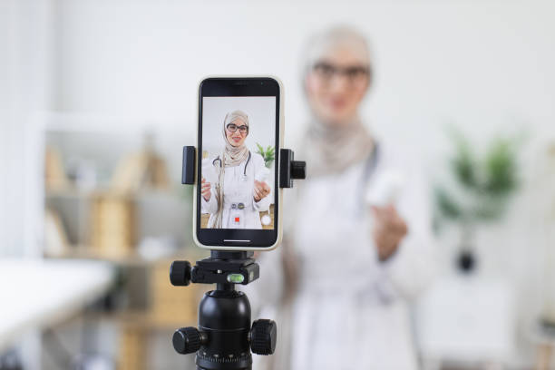 istock Muslim woman recording medical video tutorial with smartphone 2194891581