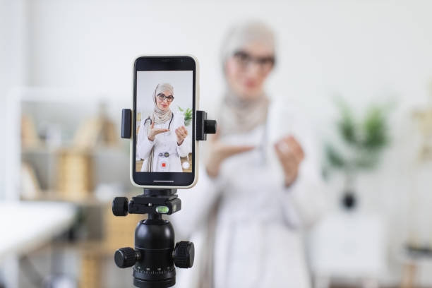 istock Muslim woman recording health tutorial with medicine bottles 2194891605