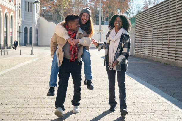 istock Young friends having fun walking in the city during winter 2194892116