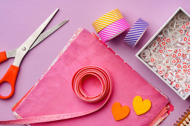 istock Crafting supplies on a purple background ready for creative projects 2194892177