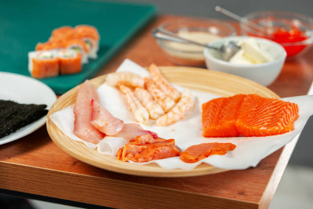 Fresh seafood assortment featuring salmon, shrimp, and various fish cuts prepared for culinary use Fresh seafood assortment featuring salmon, shrimp, and various fish cuts prepared for culinary use close up Food Grade stock pictures, royalty-free photos & images