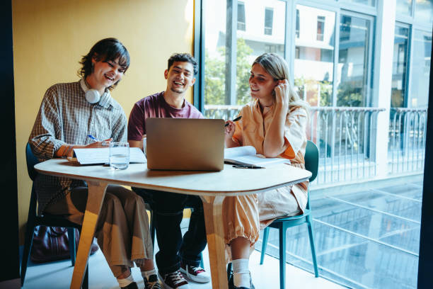 istock High school friends enjoy a video call session in the library while studying together at a round table 2194894314