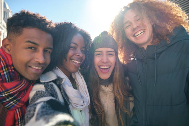istock Four young friends taking a selfie on a sunny winter day 2194894828