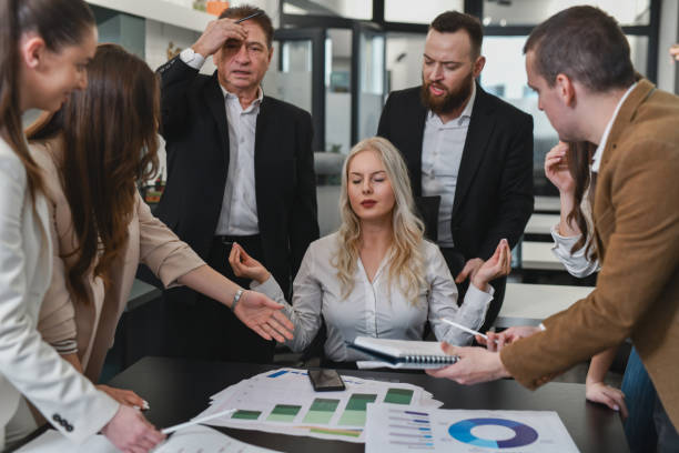 istock Female Supervisor Trying to Calm Her Mind While Employees Are Bothering Her With Requests 2194898833