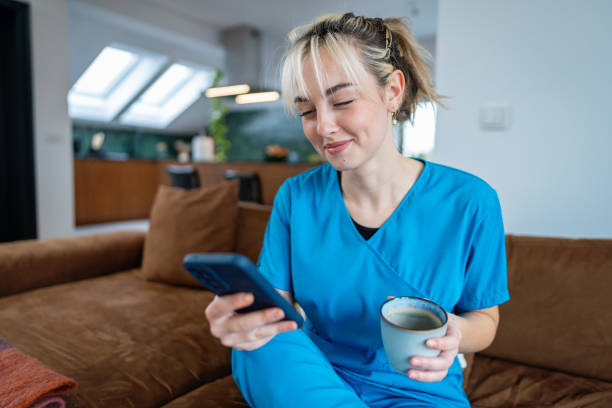 istock A nurse relaxes with coffee and internet time before starting her busy day 2194900130