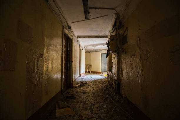 istock Corridor of abandoned apartment building 2194900784