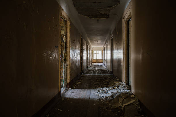 istock Corridor of abandoned apartment building 2194900844