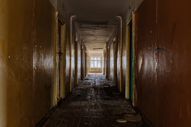 istock Corridor of abandoned apartment building 2194900920