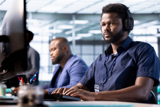 istock IT expert listening music, working in server room, maintaining databases 2194901390