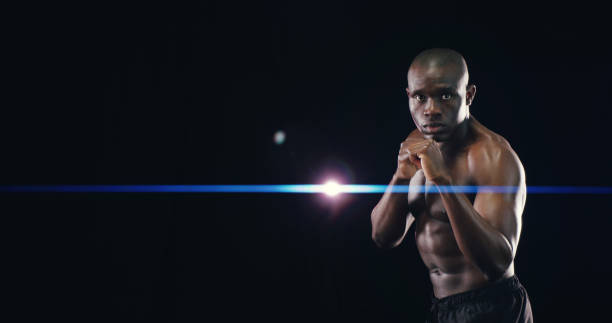 istock Mockup space, boxing and portrait of black man in studio for workout, exercise and bodybuilder training. Fitness, wellness and isolated boxer for performance, strength and muscles on dark background 2194906476