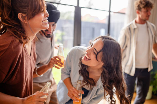 istock Friends having fun at a casual indoor gathering 2194906861