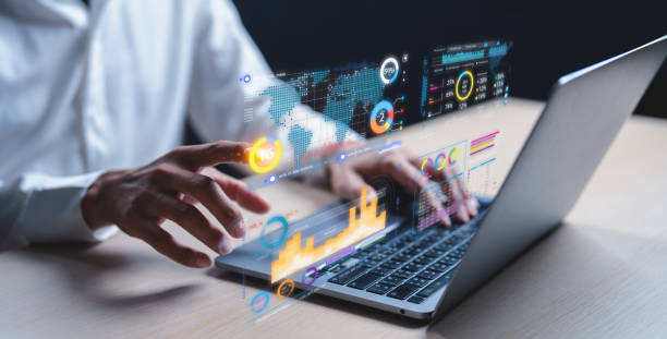 istock A businessman uses a laptop to access an AI-powered business analytics dashboard, showcasing charts, metrics, and KPIs. He analyzes performance data to generate. Data analysis concept. 2194907793
