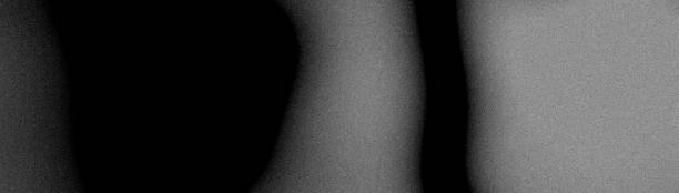 istock Grainy dark gradient black gray abstract noise texture blurred monochrome plain background banner 2194909570