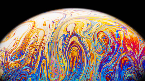 istock Closeup on a colorful soap bubble to demonstrate thin film interference physics concept with shapes and colors always in motion 2194914128