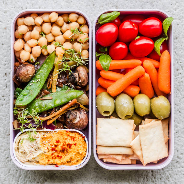 view from above of an elaborate osechi meal made with 9 different small dishes for the japanese new year