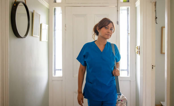 istock Nurse stands in bright entrance ready for daily duties 2194916724