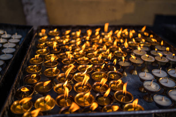 Burning earthen lamps around the Swayambhunath Stupa in Kathmandu, Nepal