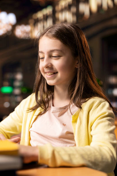istock Girl student preparing for a theoretical lecture by taking notes on pc 2194918276