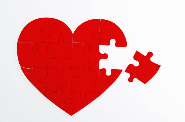 istock Heart shaped jigsaw puzzle on white background 2194919165