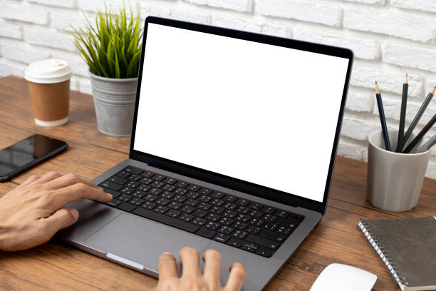 istock mock up empty screen notebook, businessman working on his laptop computer with blank space screen for advertising text on wood desk in Cafe 2194923134