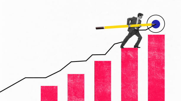 istock Businessman with oversized yellow pencil, climbing red bar graph aiming at blue bullseye, symbolizing goal achievement. Conceptual design 2194924439