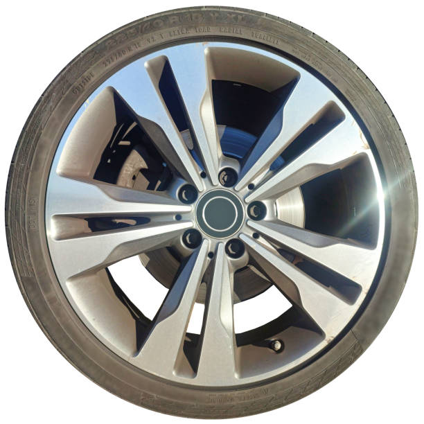 High-quality 3D render of a modern performance tire with sleek alloy rim, showing detailed tread pattern and metallic reflections. Perfect for automotive design, car parts, or transportation concepts. Object + Shadow Path