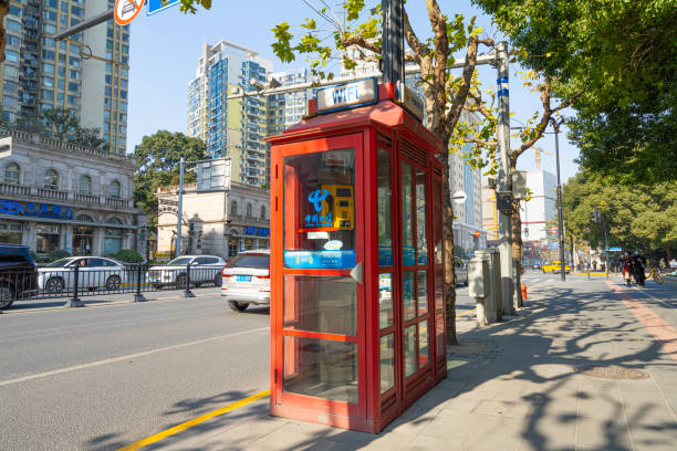 Shanghai, China. January 8, 2025. a telephone booth on a city centre sidewalk