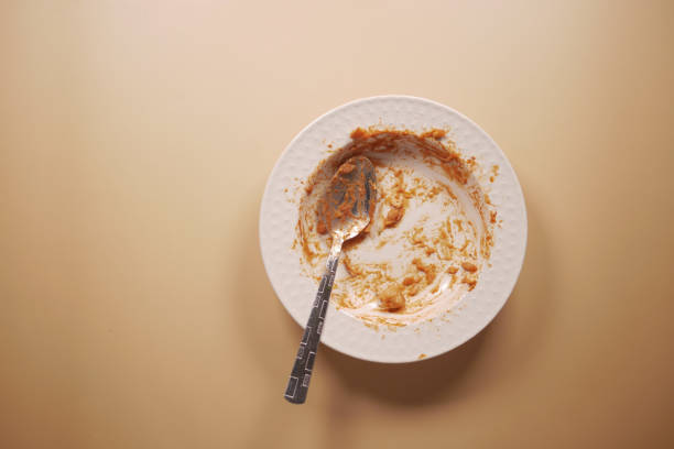 istock An empty plate with a spoon rests after a delicious, satisfying meal has been enjoyed 2194926935