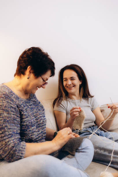 istock Mother and daughter have fun knitting 2194927721