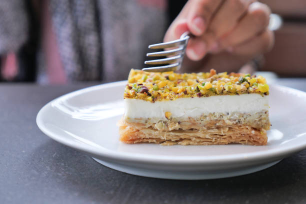 istock A Delicious Layered Dessert Artistically Arranged with Pistachios Presented on a Plate 2194927988