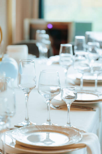 istock Elegant Table Setting with Crystal Glasses and White Plates for a Formal Event 2194928261