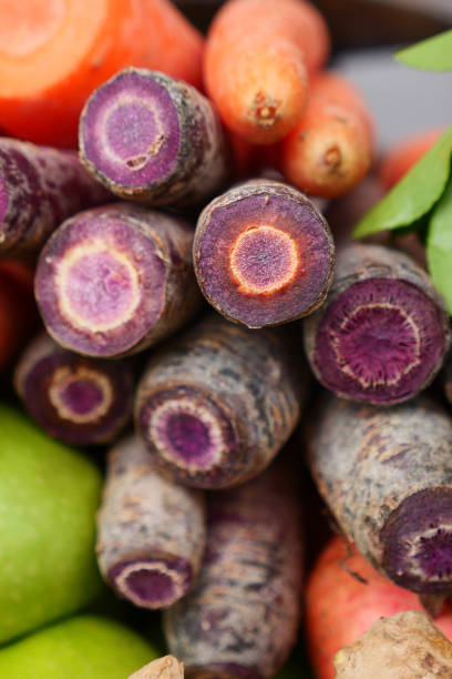 A Vibrant and Colorful Display of Fresh Carrots Along with Various Root Vegetables