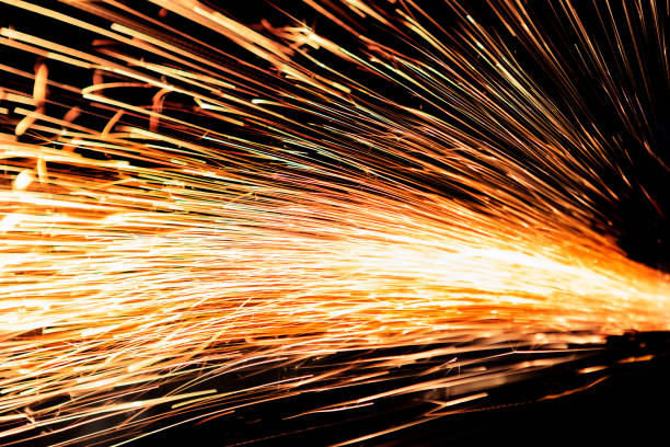 Bright Sparks of metal against dark background