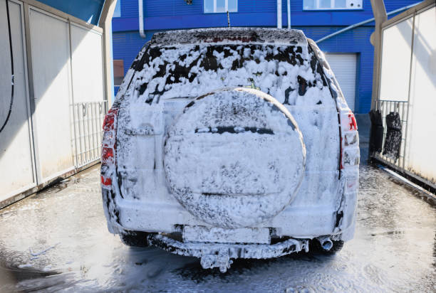 Car covered in foam at a car wash close-up