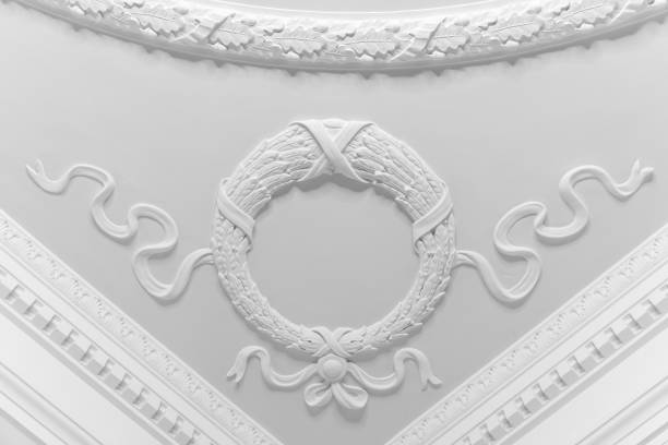 White gypsum bas-relief details, ceiling corner design with a wreath with ribbons, classic architecture abstract template