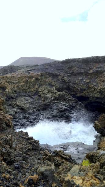 istock Ocean waves crashing against volcanic rocks in Lanzarote 2194937846