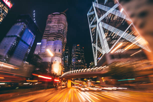 istock Dynamic Nighttime Cityscape with Illuminated Skyscrapers and Motion Blur 2194938353