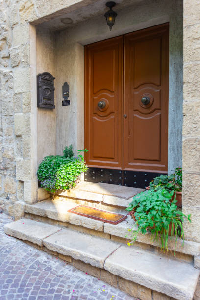 istock Windows and doors in an old house decorated with flower 2194938898
