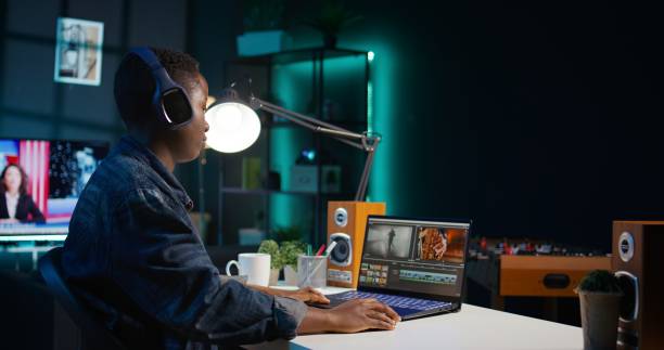 Video editor adds sound effects to filmed footage, wearing headphones Video editor adds sound effects to filmed footage, working in home studio. Videographer using headphones to test and improve audio quality, editing clips with professional software, camera B female film editor stock pictures, royalty-free photos & images