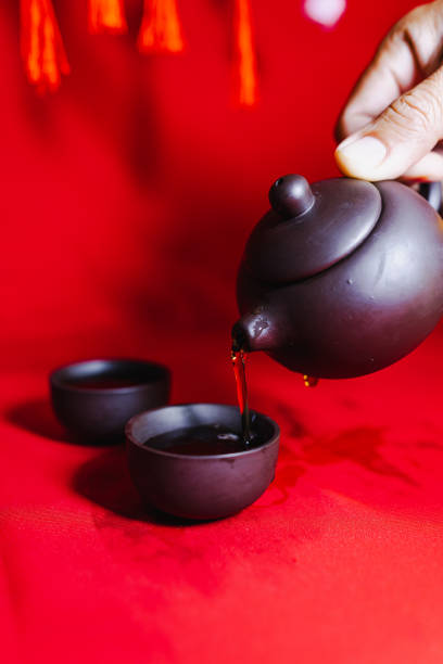 Chinese New Year Concept, Traditional Chinese Tea Set On Red Background.
