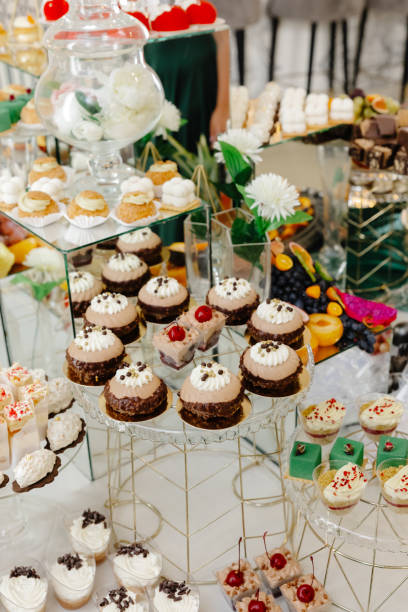 istock Catering service presenting tiered dessert table with delicious pastries and cakes 2194940635