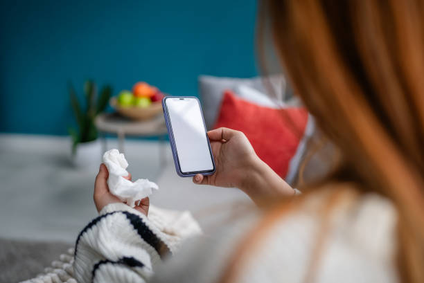 istock Holding phone, thoughtful expression, calm ambiance. 2194941871