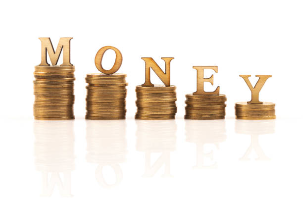 MONEY word on stack of coins isolated on white background
