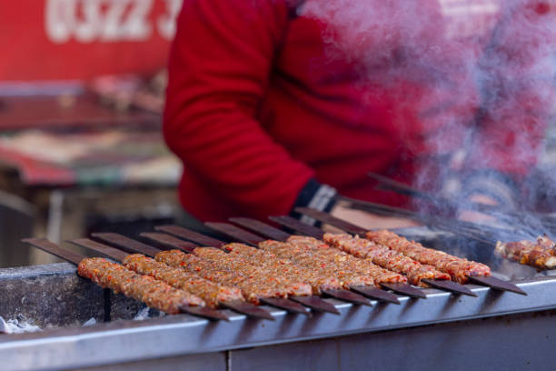 cooking Turkish adana kebab on grill