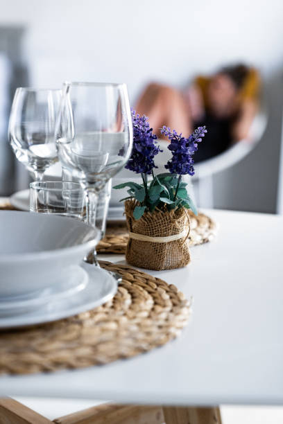istock Elegant dining setup with floral decoration in a modern kitchen space 2194944673
