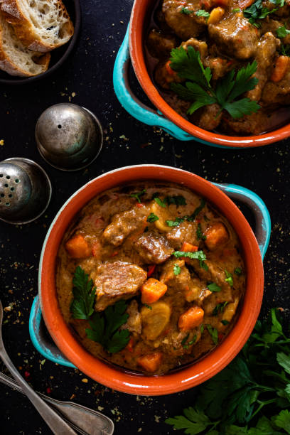 istock Beef goulash with vegetables on black table 2194945411